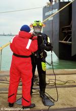 ID 8518 AMSTERDAM (1996/18259grt/IMO 9125956, renamed UTRECHT) at the time the worlds' largest dredger, berthed in Southampton, England. Divers prepare to do an underwater inspection.