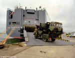 ID 8428 HUAL TRANSPORTER (1999/57757grt/IMO 9176395. Renamed HOEGH TRANSPORTER in 2007) loading military vehicles at SOuthampton, England.