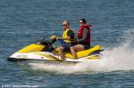 ID 12403 Jetskiers out for a morning on the harbour, enjoy the early summer sunshine, Auckland, New Zealand.